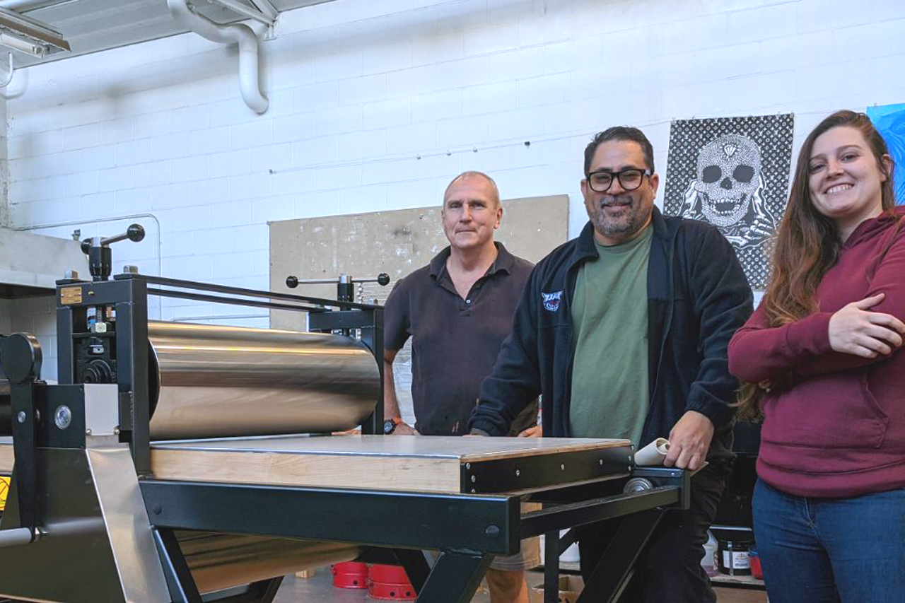 Sydney Woods, current MFA student in VAAH (left), Velasquez and Col. Otto Rutt, MFA '20 and currently adjunct instructor in Printmaking.